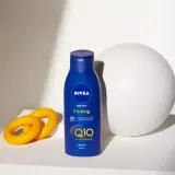 NIVEA Q10 молочко для тела подтягивающее с витамином C, 400 мл — фото 2